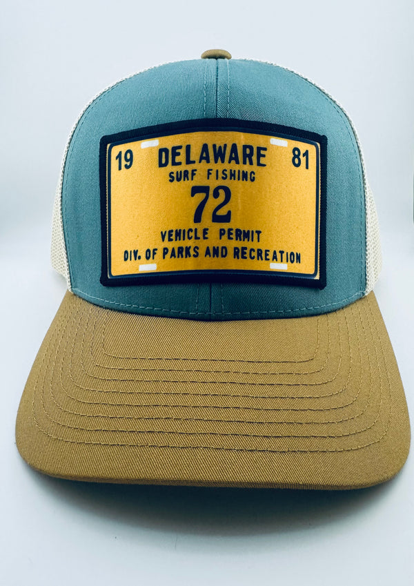 Trucker style hat in Delaware colors with an image taken from an authentic vintage surf tag from 1981. 